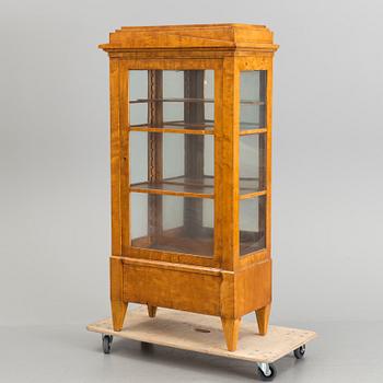 A Swedish first half of the 19th century display cabinet veneered with birch.