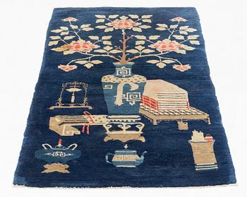 A Boutou rug, China, c. 145 x 75 cm.