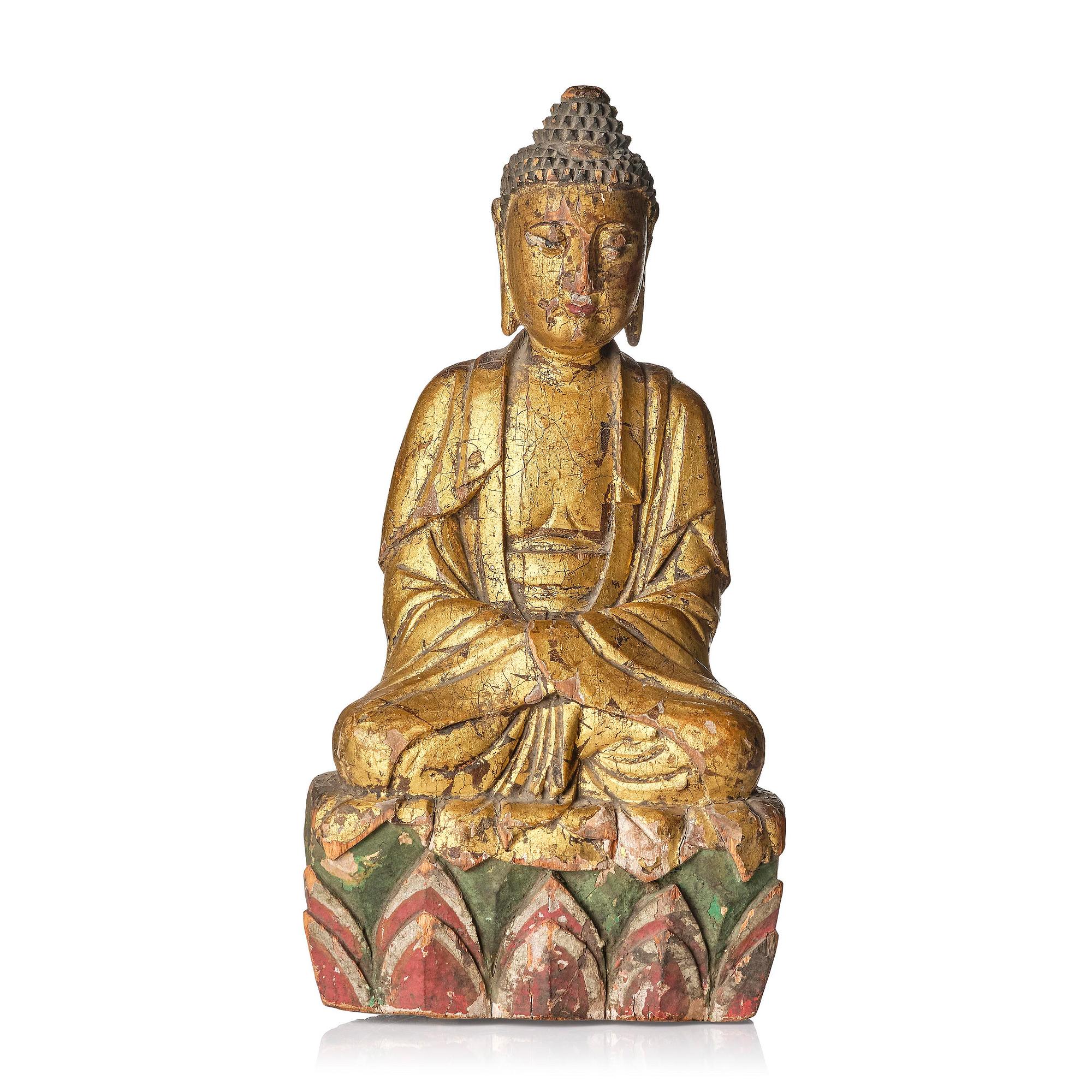 A wooden sculpture of Buddha, 19th century. With inscription to the back.