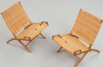 Hans J. Wegner, a pair of oak and rattan 'Folding chairs', model 512, Johannes Hansen, Denmark 1950's.