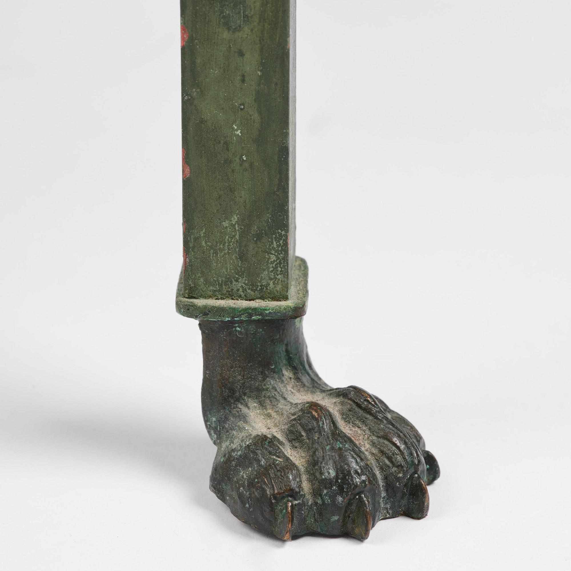 A table with Swedish 'Orrlok' porhyry top, early 19th century on a later bronze stand.