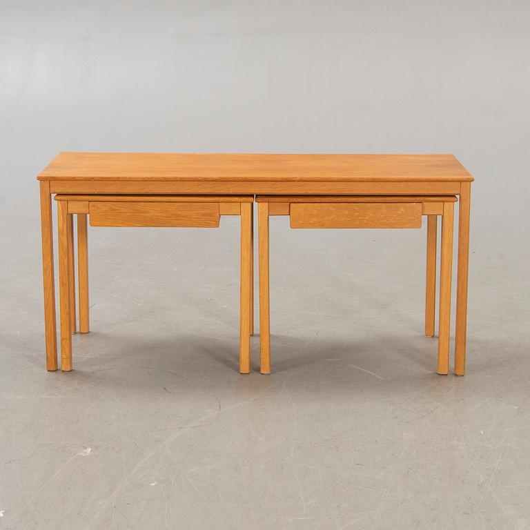 A 1960s oak nesting table.