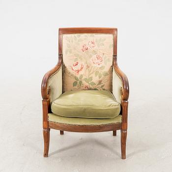 A mid 1800s mahogany bergere.