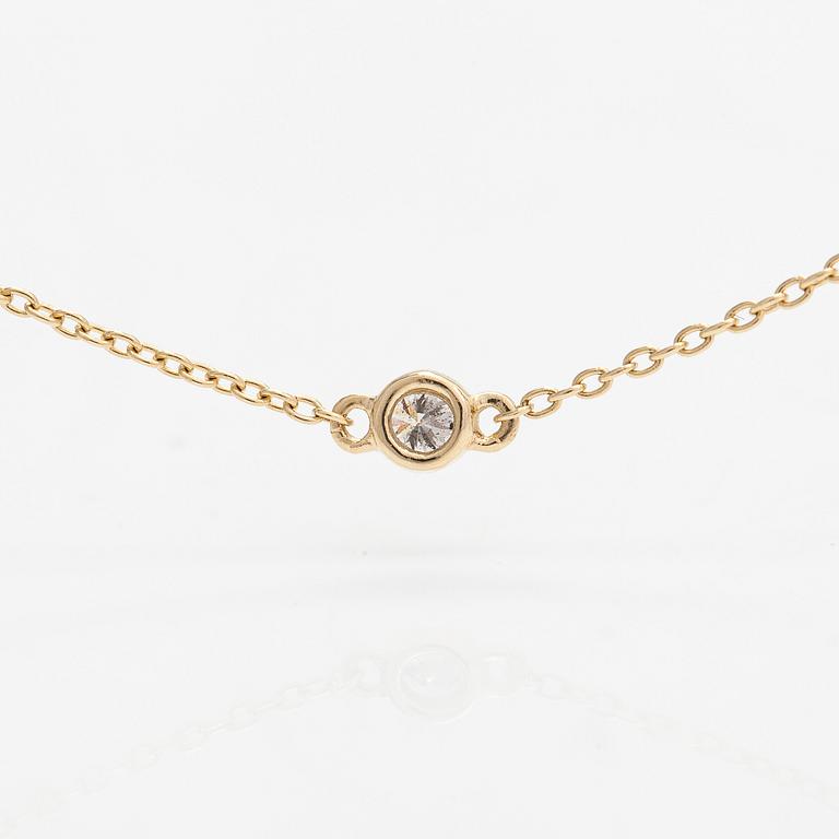 A 14K gold necklace with diamonds ca. 0.15 ct in total.