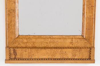 A birch veneered Swedish mirror, late empire, mid 19th Century.