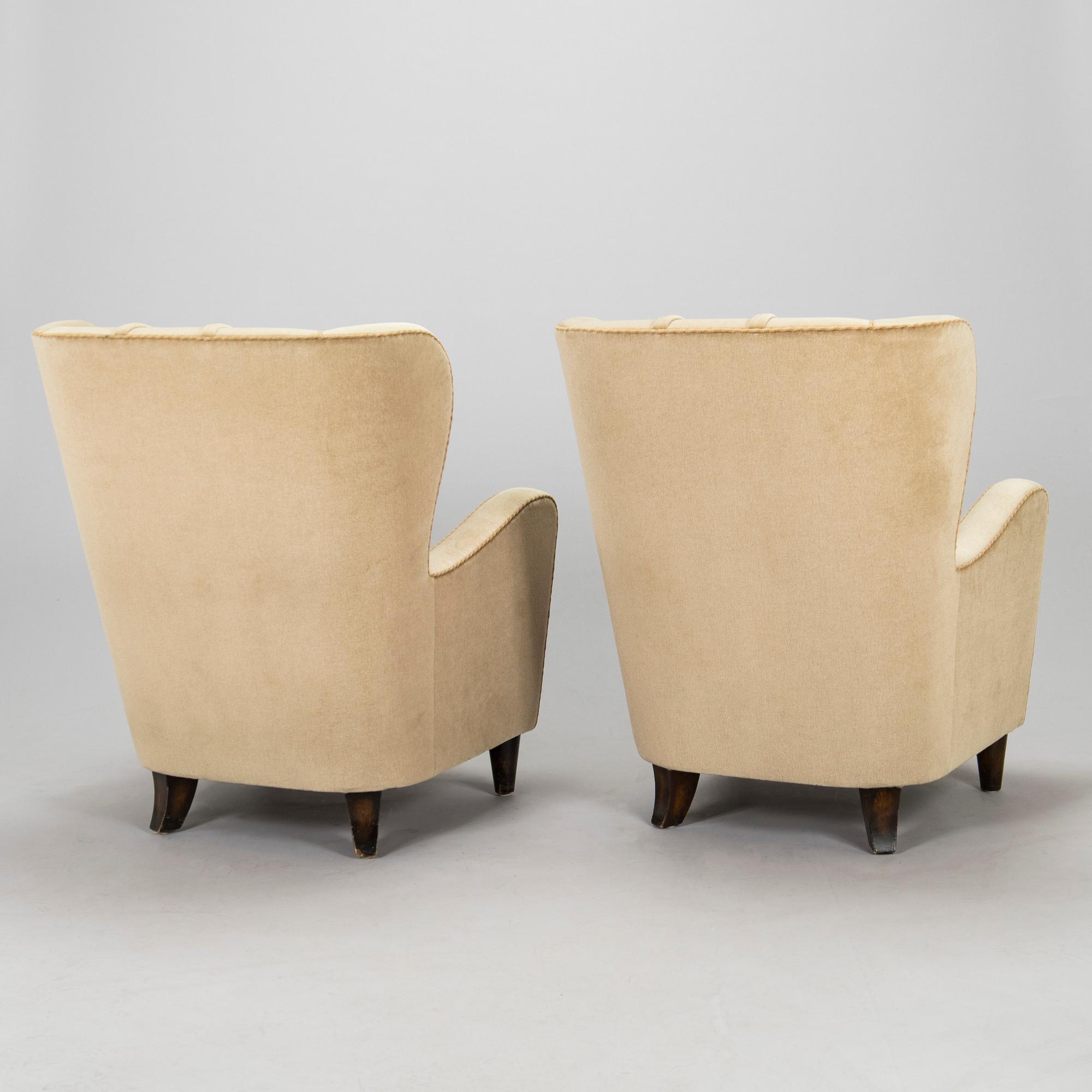 A pair of mid-20th century armchairs.