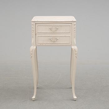 A 20th century rococo style bedside table.