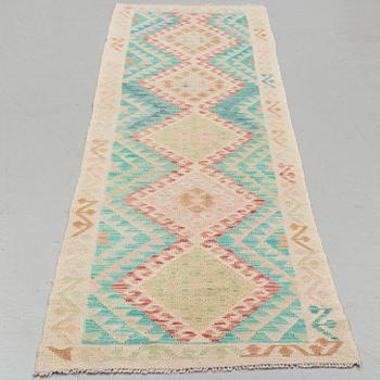 A kilim runner, around ca 290 x 72 cm.