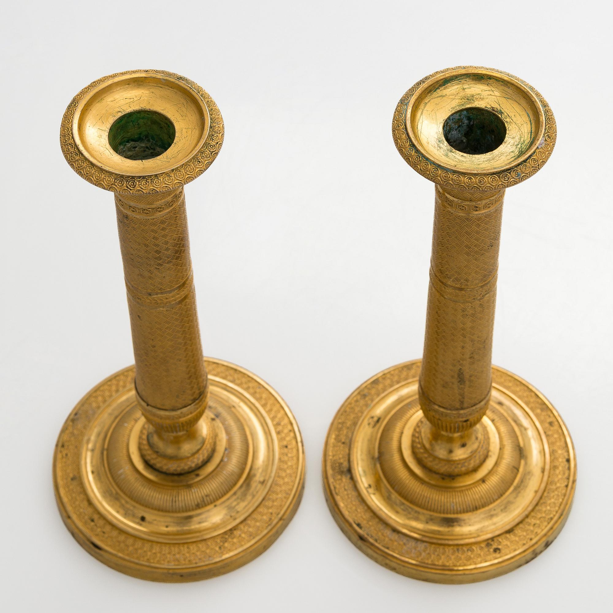 A pair of early 19th century French Empire candlesticks.