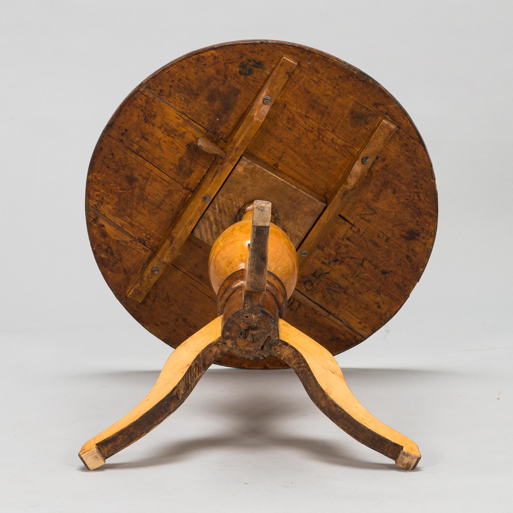 A tilt top table from 19th Century.