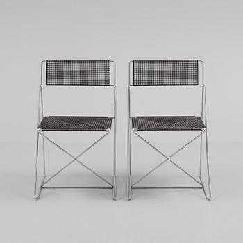 A set of four "X-line" chairs by Niels Jörgen Haugesen.