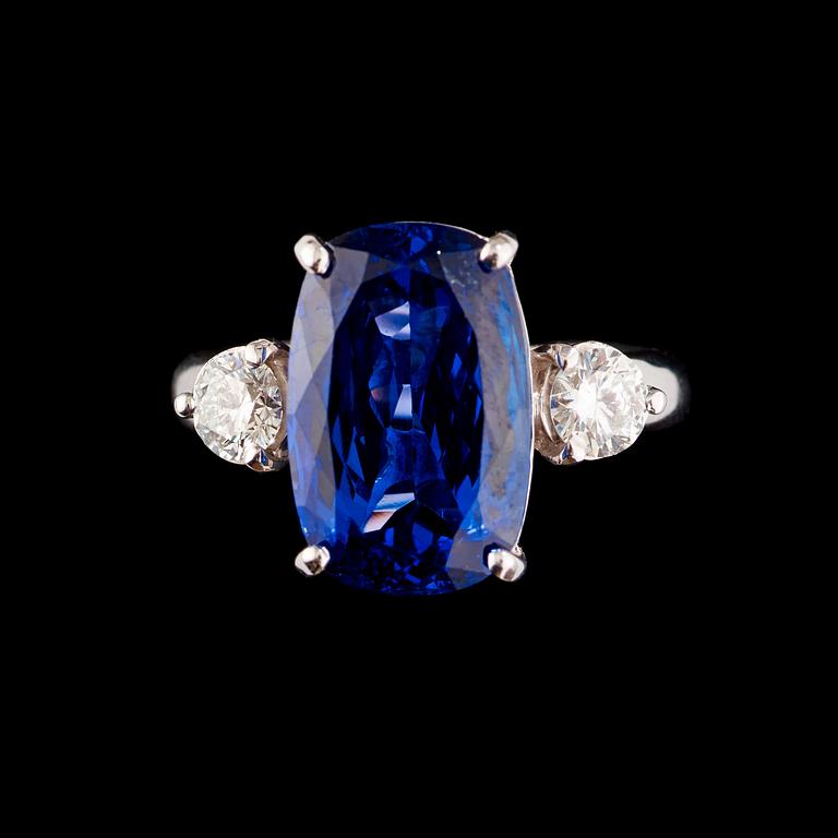 A tanzanite, 8.20 cts, and brilliant-cut diamond ring. Total carat weight of diamonds circa 0.58 ct.