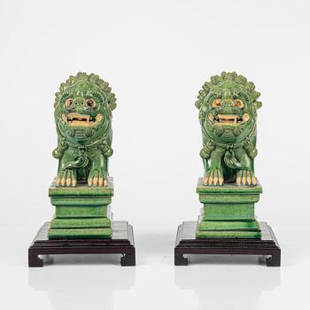 A pair of green glazed figures of mythical beasts, Ming style, China, 20th Century.