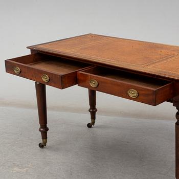 A late 19th century English writing table signed Holland & Sons.