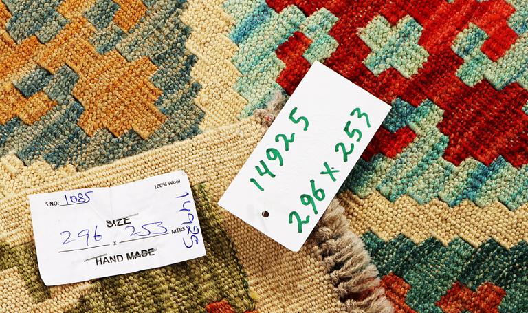 A Kilim carpet, c. 296 x 253 cm.
