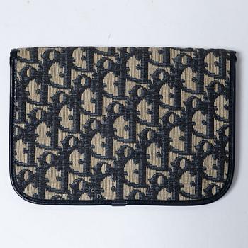 Christian Dior, a clutch and a scarf.