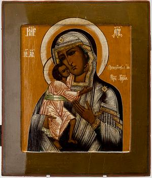 ICON, tempera on wood panel, RIZA, gilded silver and garnets, Russia latter half of 19th century.