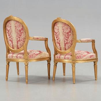 A matched pair of Gustavian late 18th cenury armchairs.