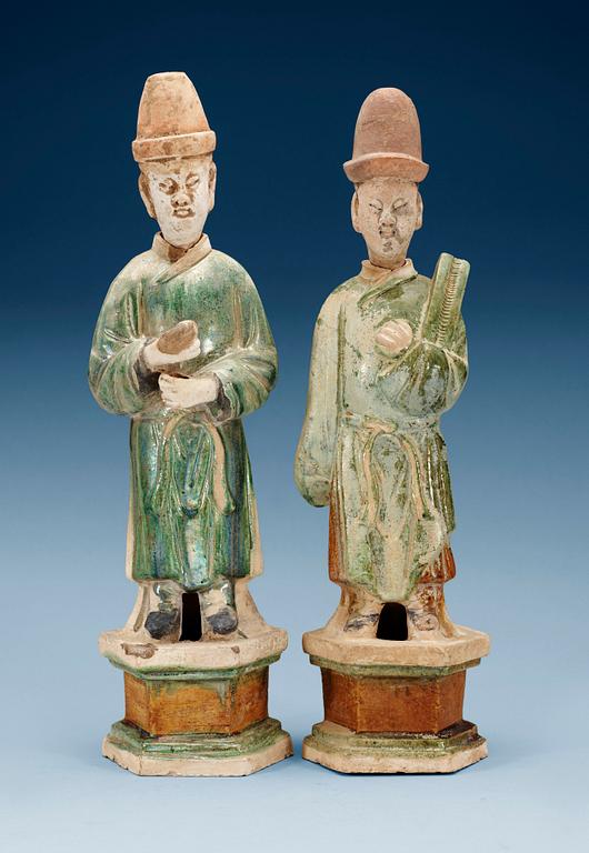 Two green and yellow glazed potted figures of Dignitaries, Ming dynasty.