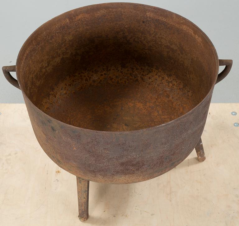 A 19th century iron pot.