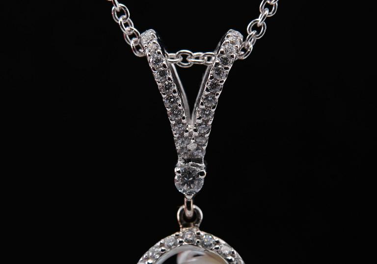 A PENDANT, brilliant cut diamonds c. 0.96 ct. Baroque south sea pearl. Weight 13,4 g.