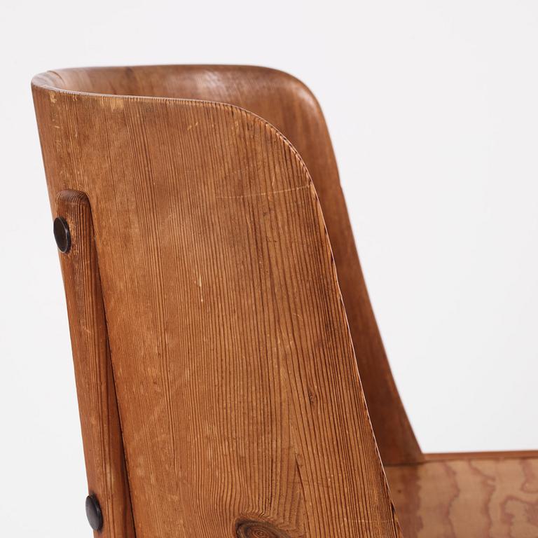 Axel Einar Hjorth, a pair of "Lovö" stained pine armchairs, Nordiska Kompaniet 1930s.