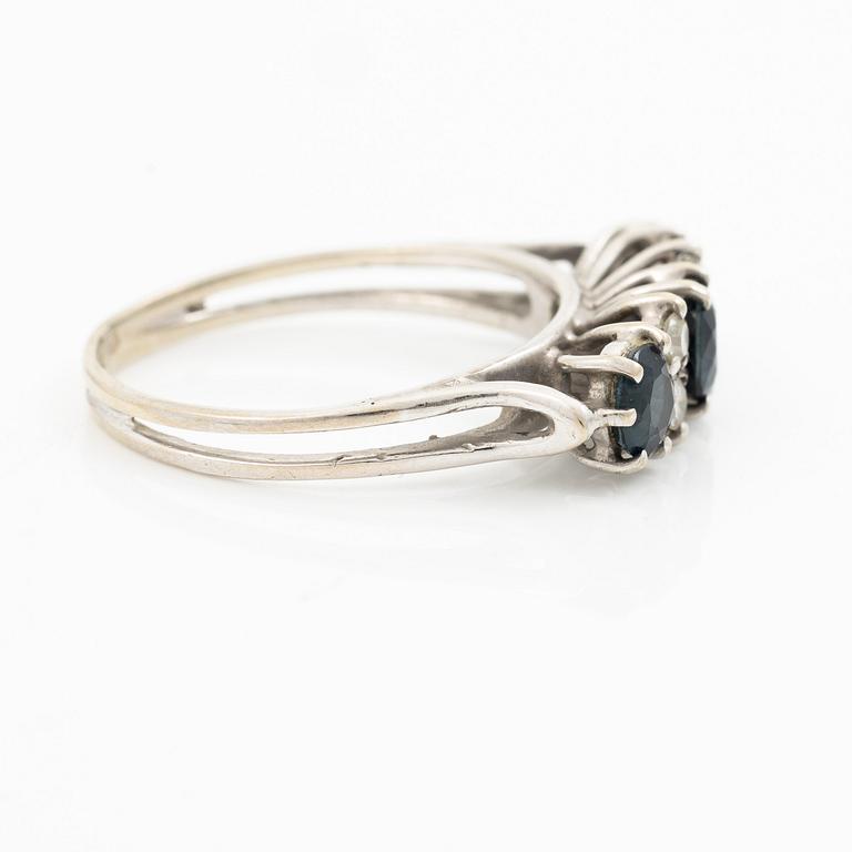 Ring, 18K white gold, set with three sapphires and single-cut diamonds.