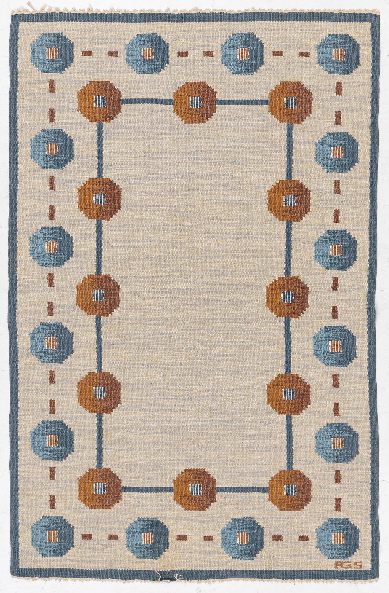 A flat weave carpet by Anna-Greta Sjöqvist c 223 x 144 cm, signed AGS.
