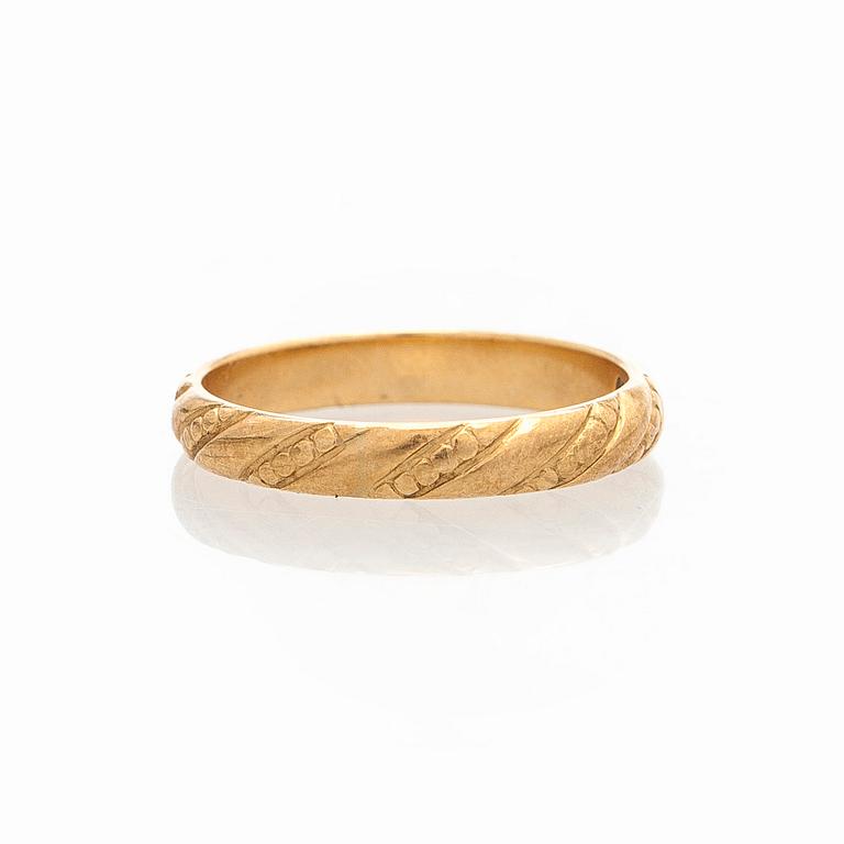 Kalevala Koru, ring "Halikon Lampolan kierresormus", 18K guld, Helsingfors 1998.