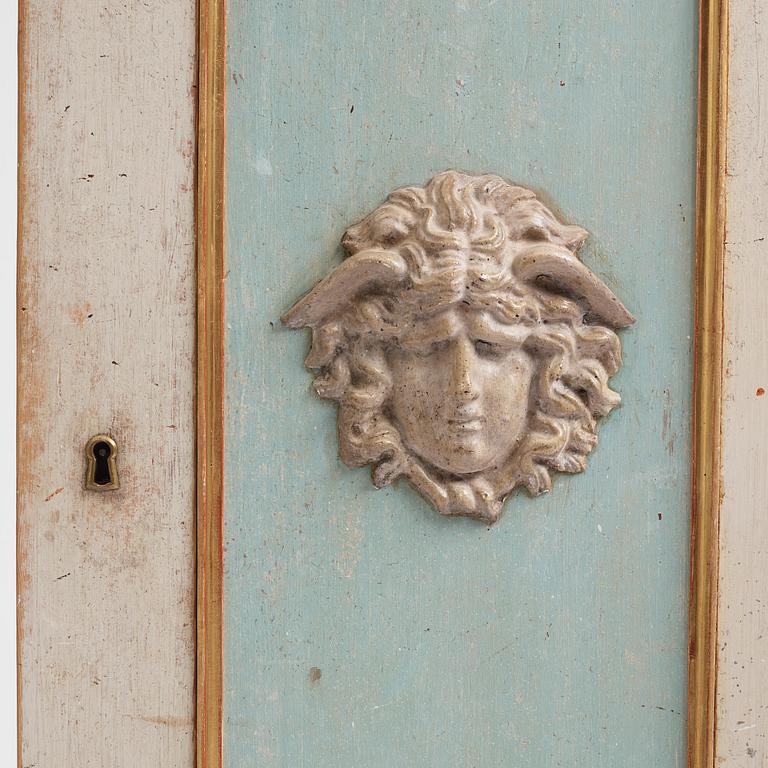 A pair of late Gustavian-style column-shaped cabinets, Stoockholm, early 19th century and later.