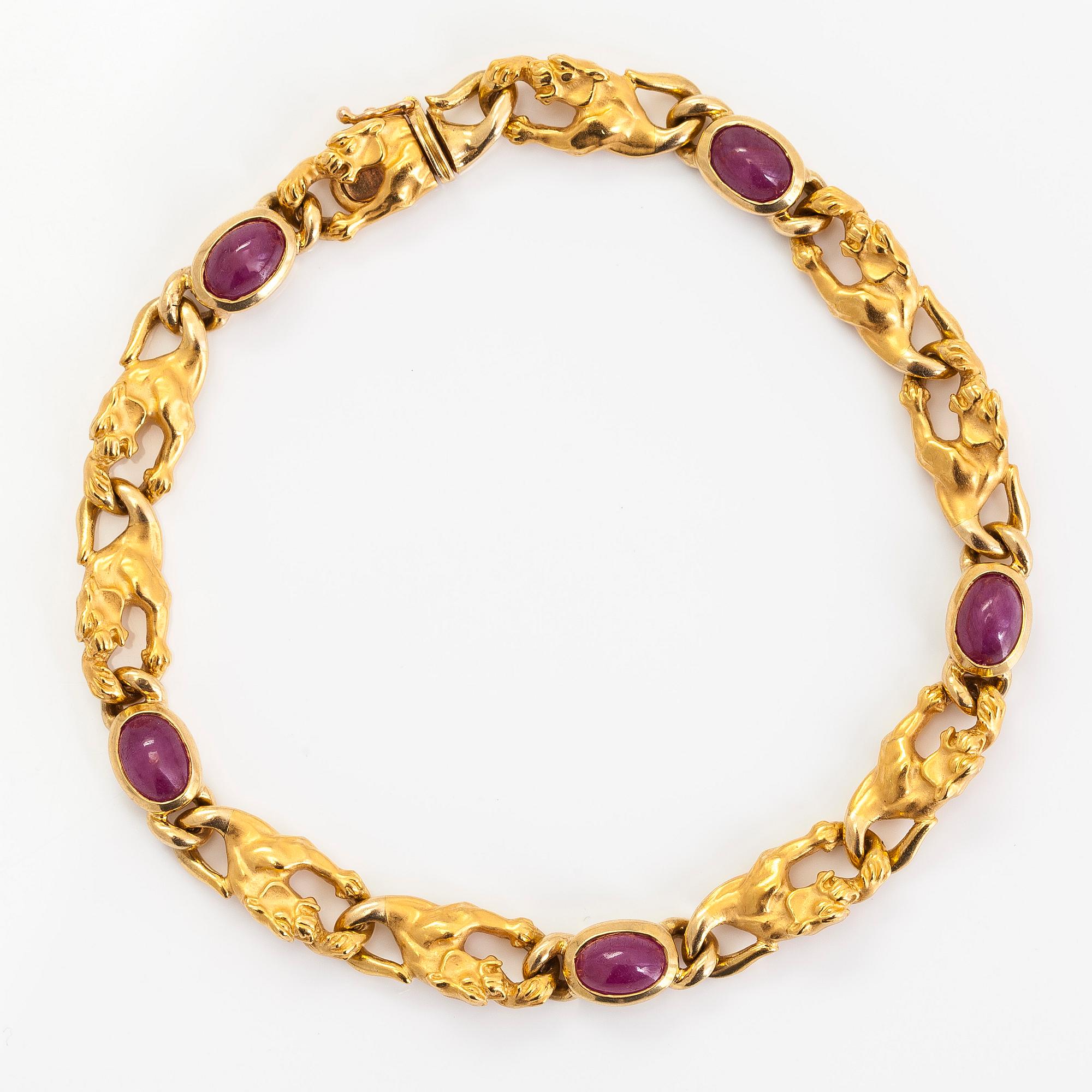 Carrera y Carrera, an 18K gold bracelet, in the shape of panthers with cabochon-cut rubies.