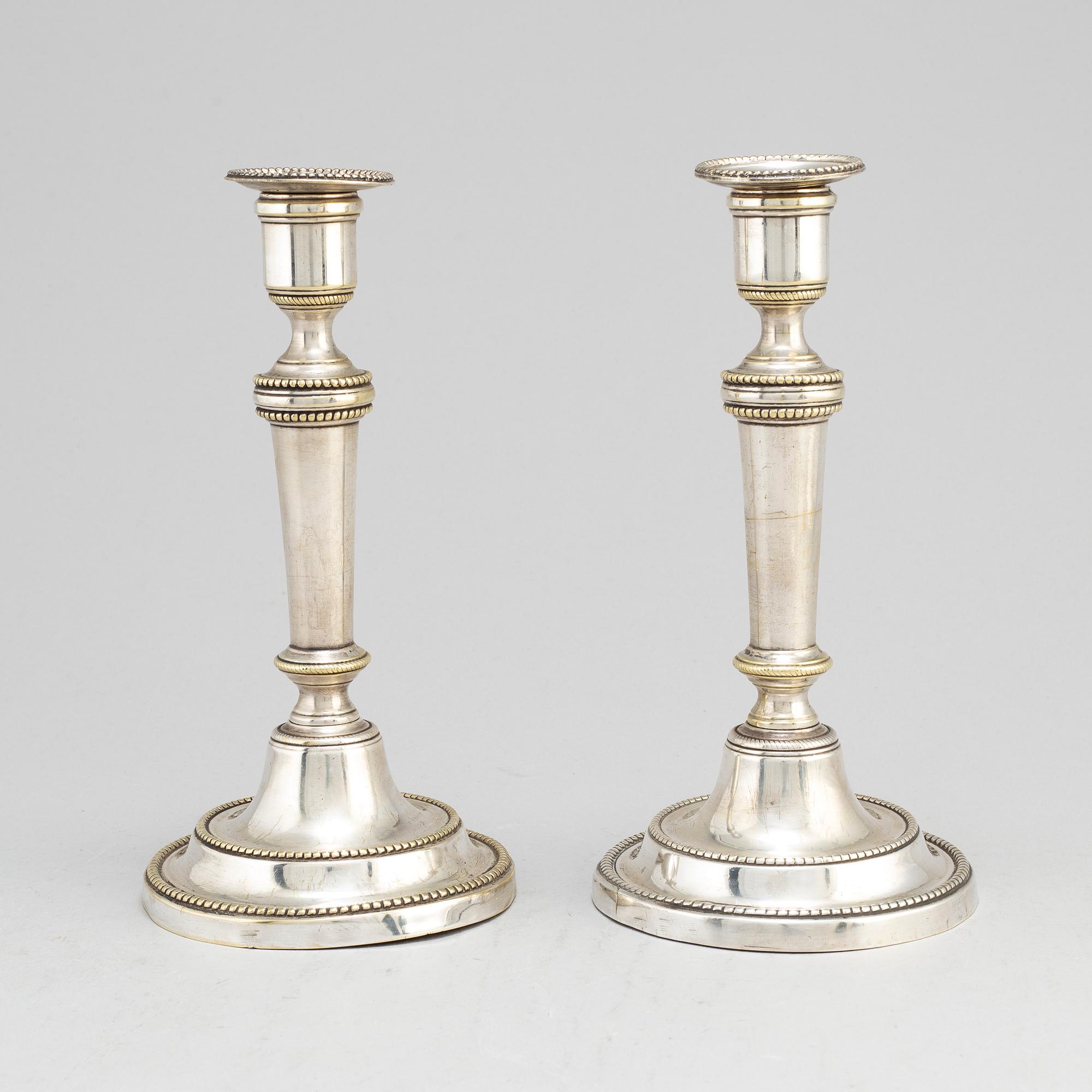A pair of late 18th century/early 19th century plate candlesticks.