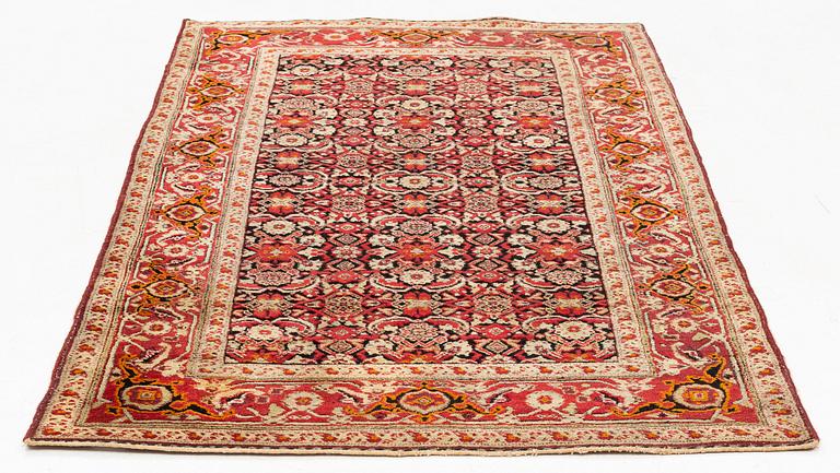 An antique Agra rug, ca 208 x 127 cm.