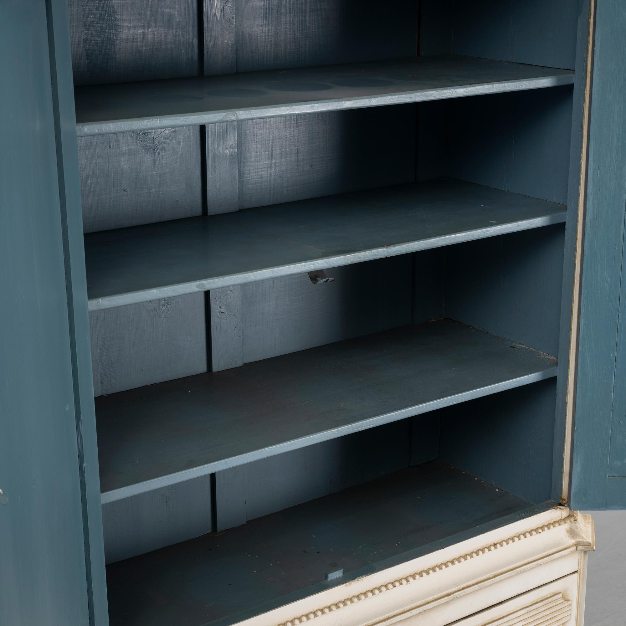 A gustavian style cabinet, circa 1900.