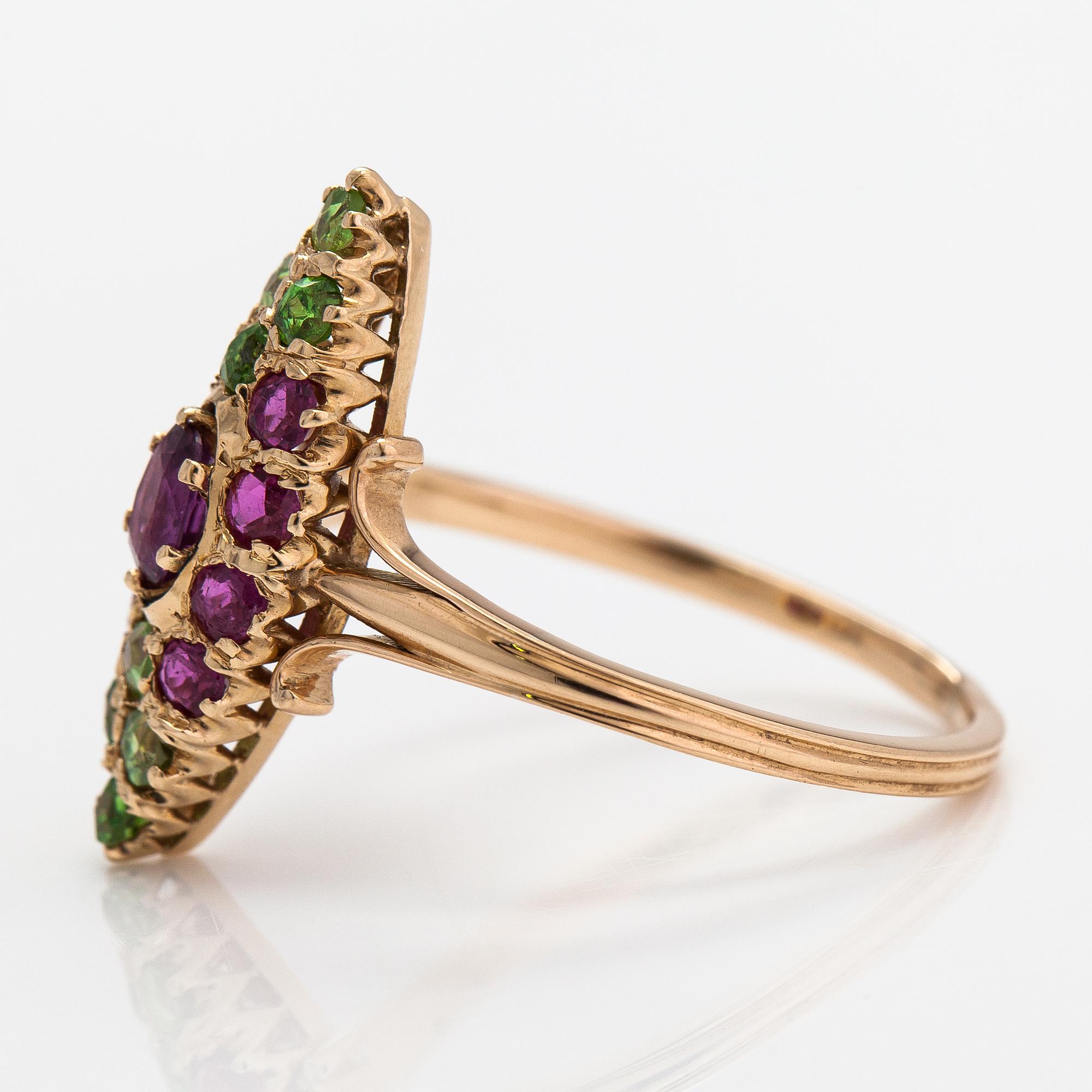 A 14K gold ring with rubies and demantoid garnets. Control marked Anton Vasilijevitch Richter, Astrakhan 1899-1916.
