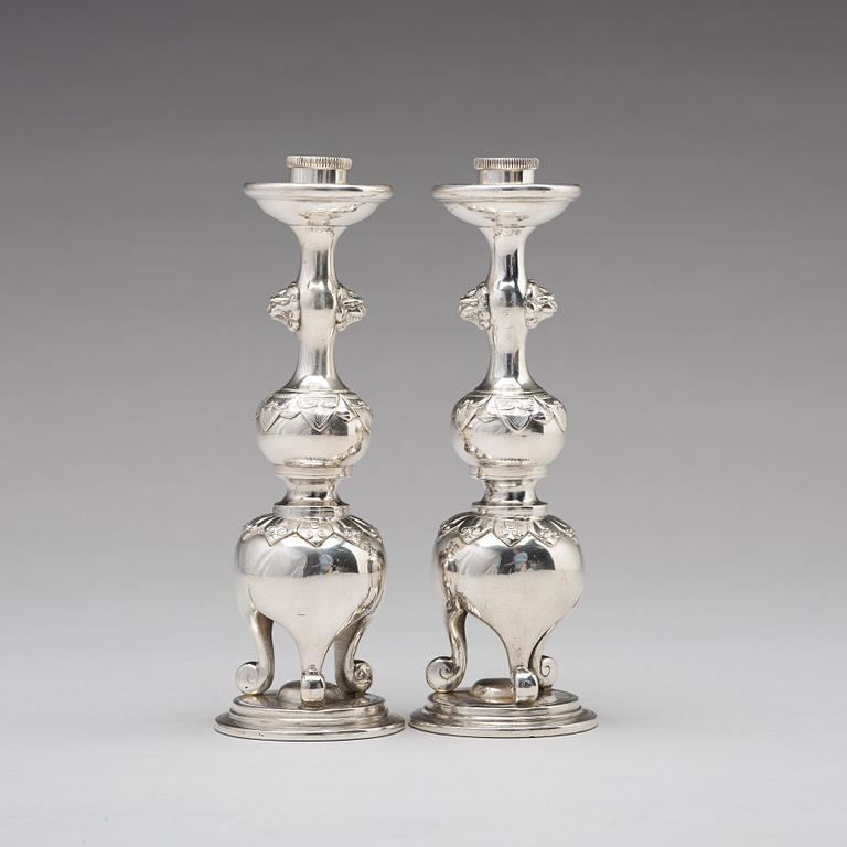 A pair of Chinese silver candle sticks, Shanghai, early 20th Century.