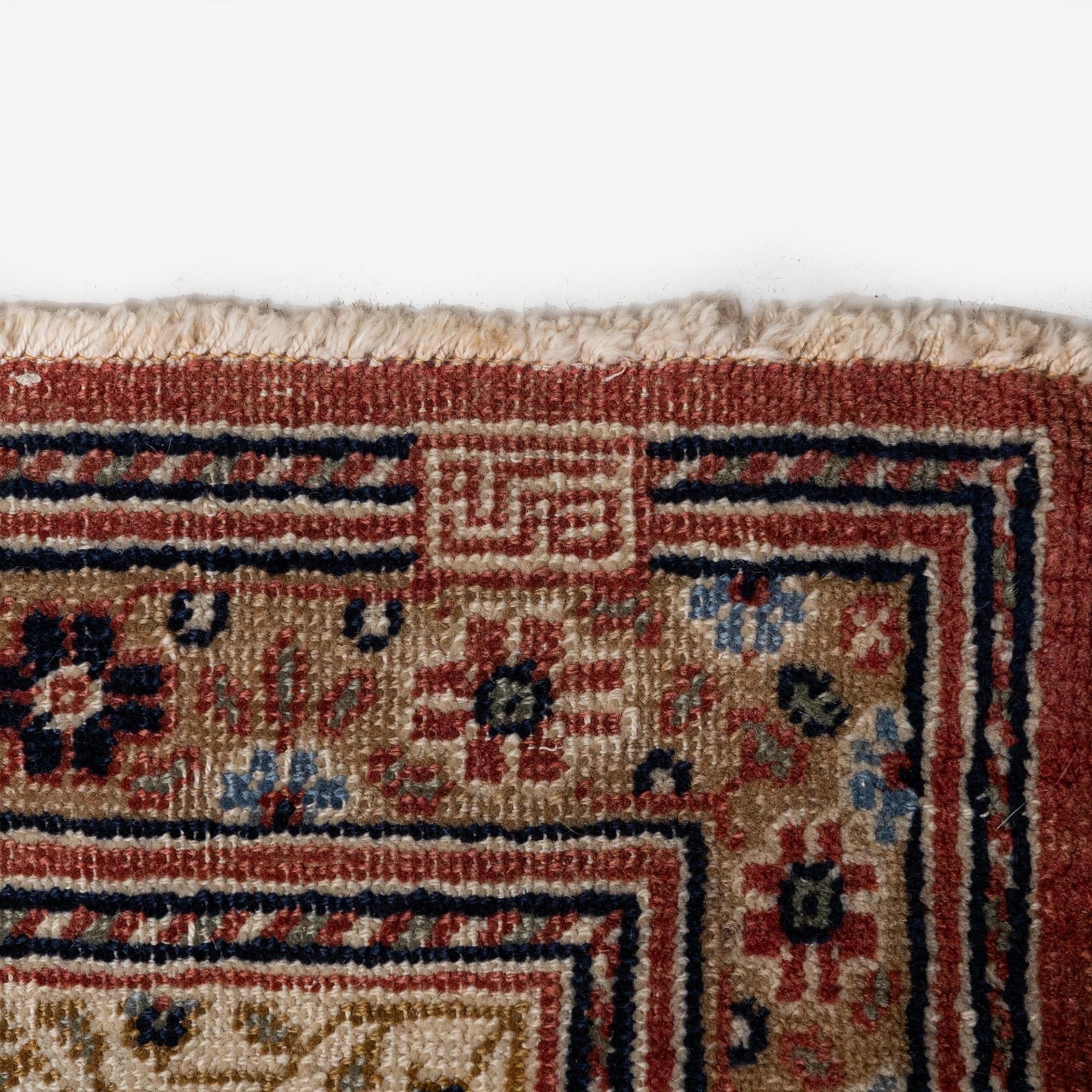 A semi-antique Hereke carpet, Western Turkey, c. 685 x 489 cm.