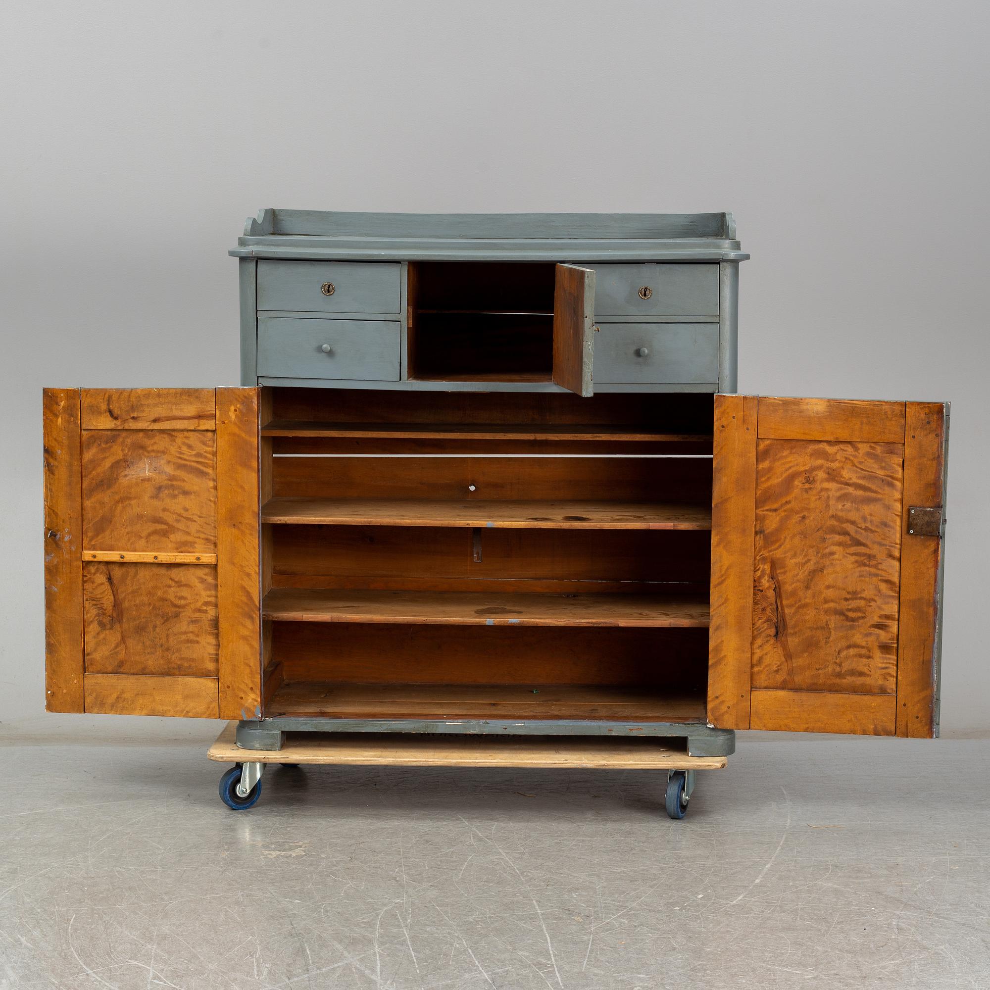 A mid 19th century painted cupboard.