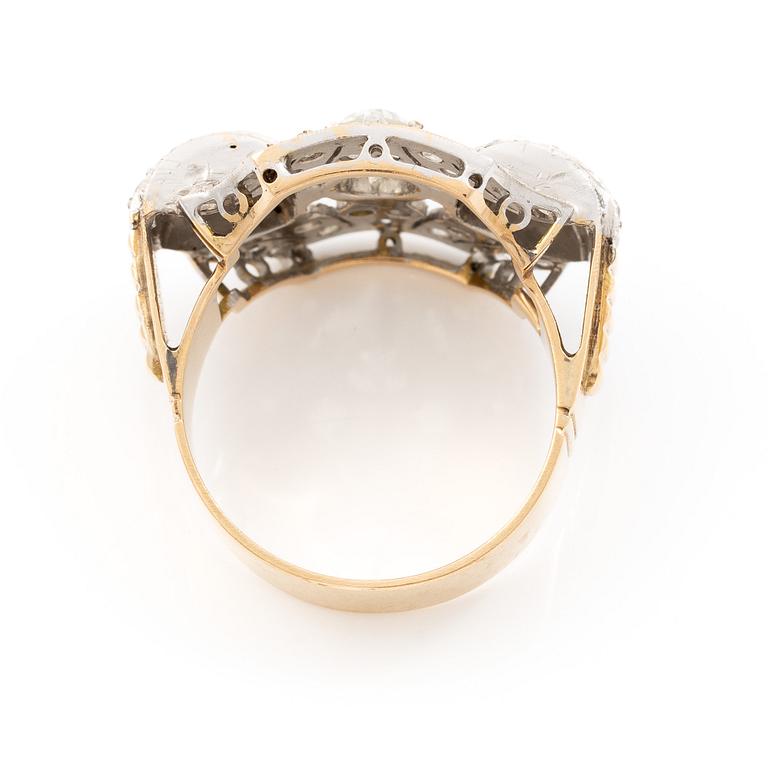 Ring in 18K gold and platinum set with an old-cut diamond and rose-cut diamonds.
