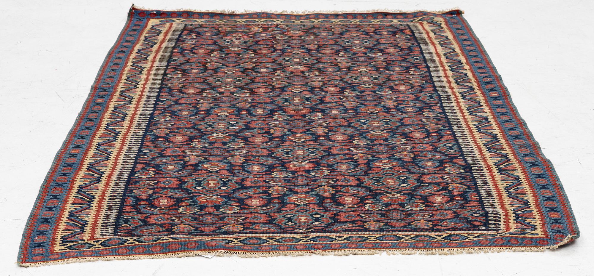 An antique Senneh kilim, West Persia, c. 149 x 11 cm.