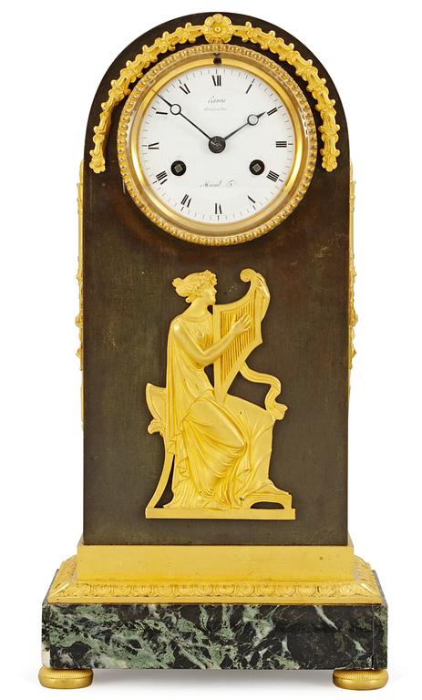 A French Empire mantel clock by A. A. Ravrio.