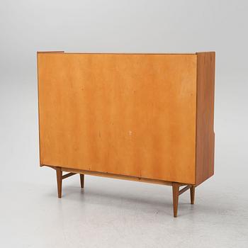 A teak veneered cabinet, 1960s.