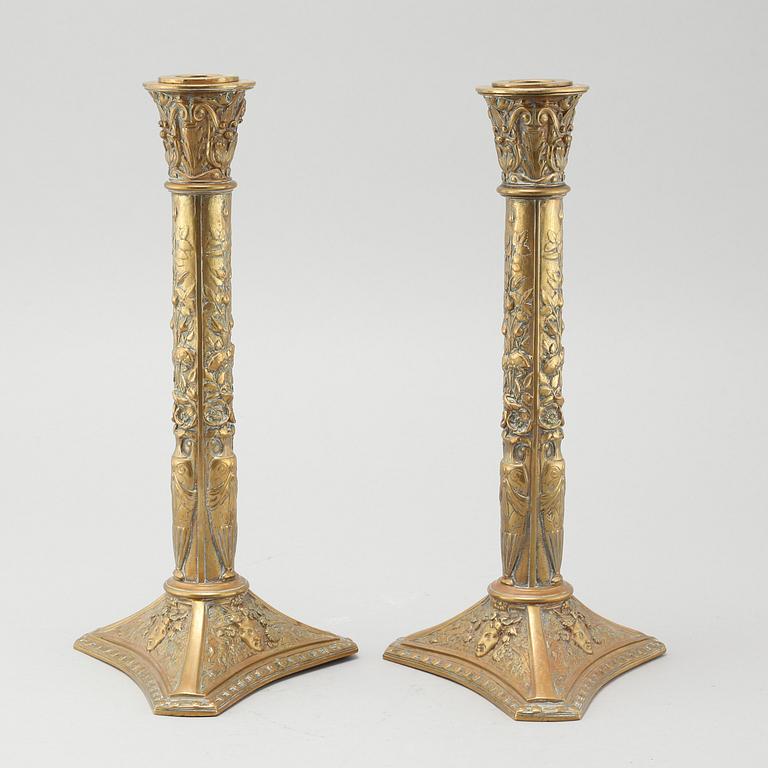 A pair of brass candlesticks from Elkingtons in Birmingham, 19th century.