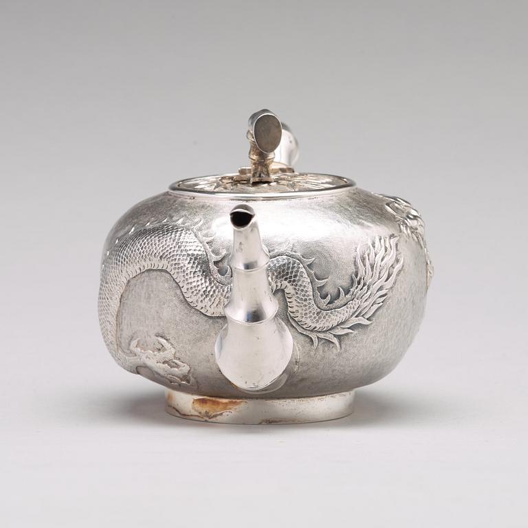 A Chinese four piece silver tea set, Luen Wo, Shanghai, 1875-1925.