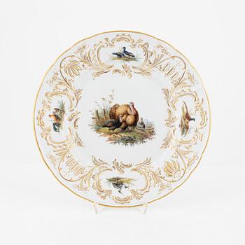 A set of five Meissen porcelain games plates, late 19th to early 20th century.