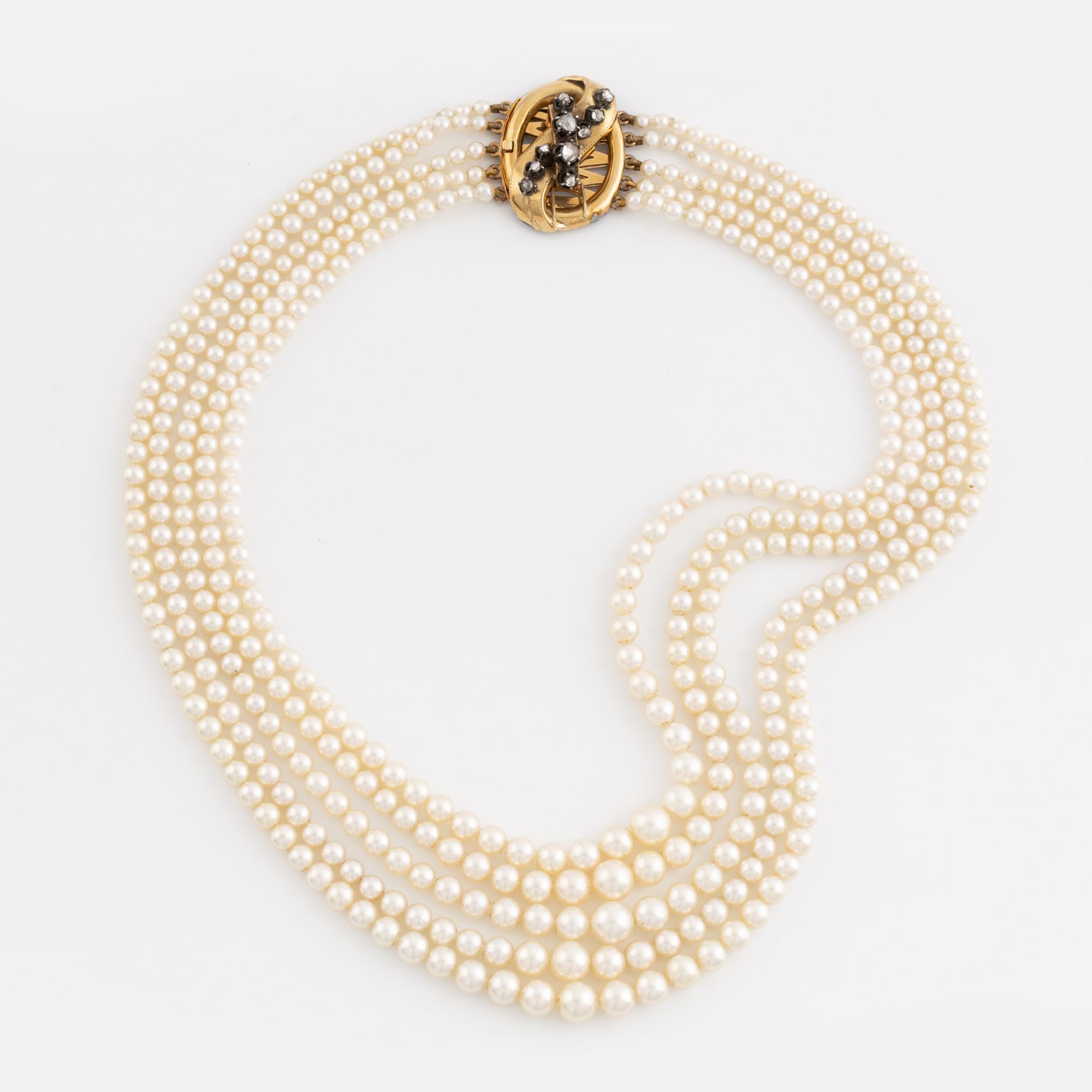 Five strand calibrated cultured pearl necklace, goldclasp with rose cut diamonds.