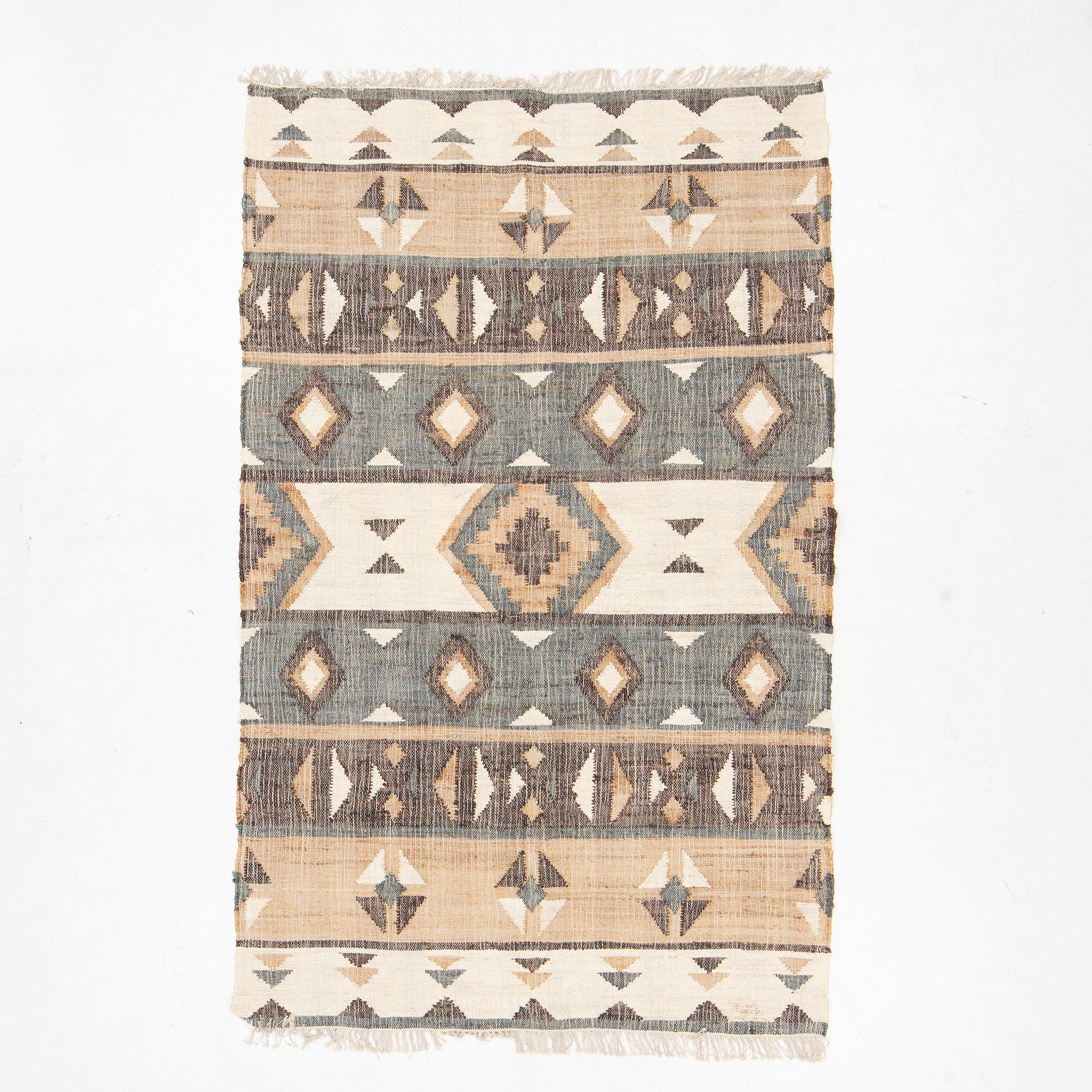 An Indian flat weave carpet,  approx. 287 x 174 cm.