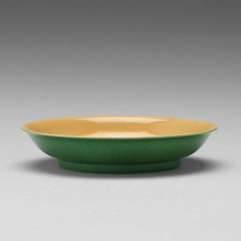 592. A yellow glazed dish, Ming dynasty, Xuande mark and of the period (1425-35).