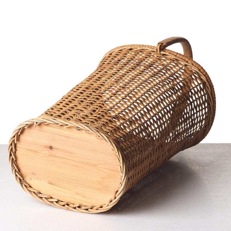 Firma Svenskt Tenn, a fretted rattan umbrella stand, mid 1900's, provenance Estrid Ericson.