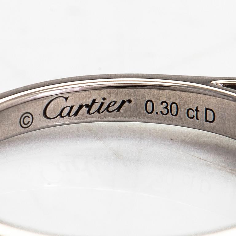 Cartier, sormus, platinaa ja timantti n. 0.30 ct kaiverruksen mukaan.
